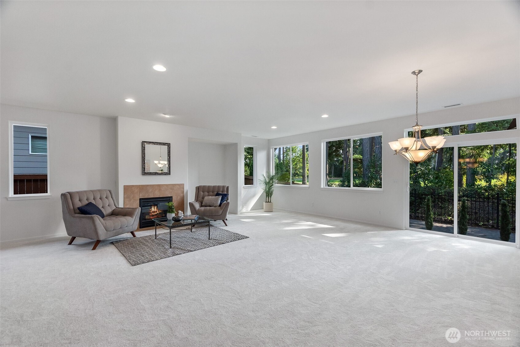 8231 Orcas Loop Northeast Lacey, WA 98516 - Photo 4 of 23 a view of an empty room with furniture and floor to ceiling window