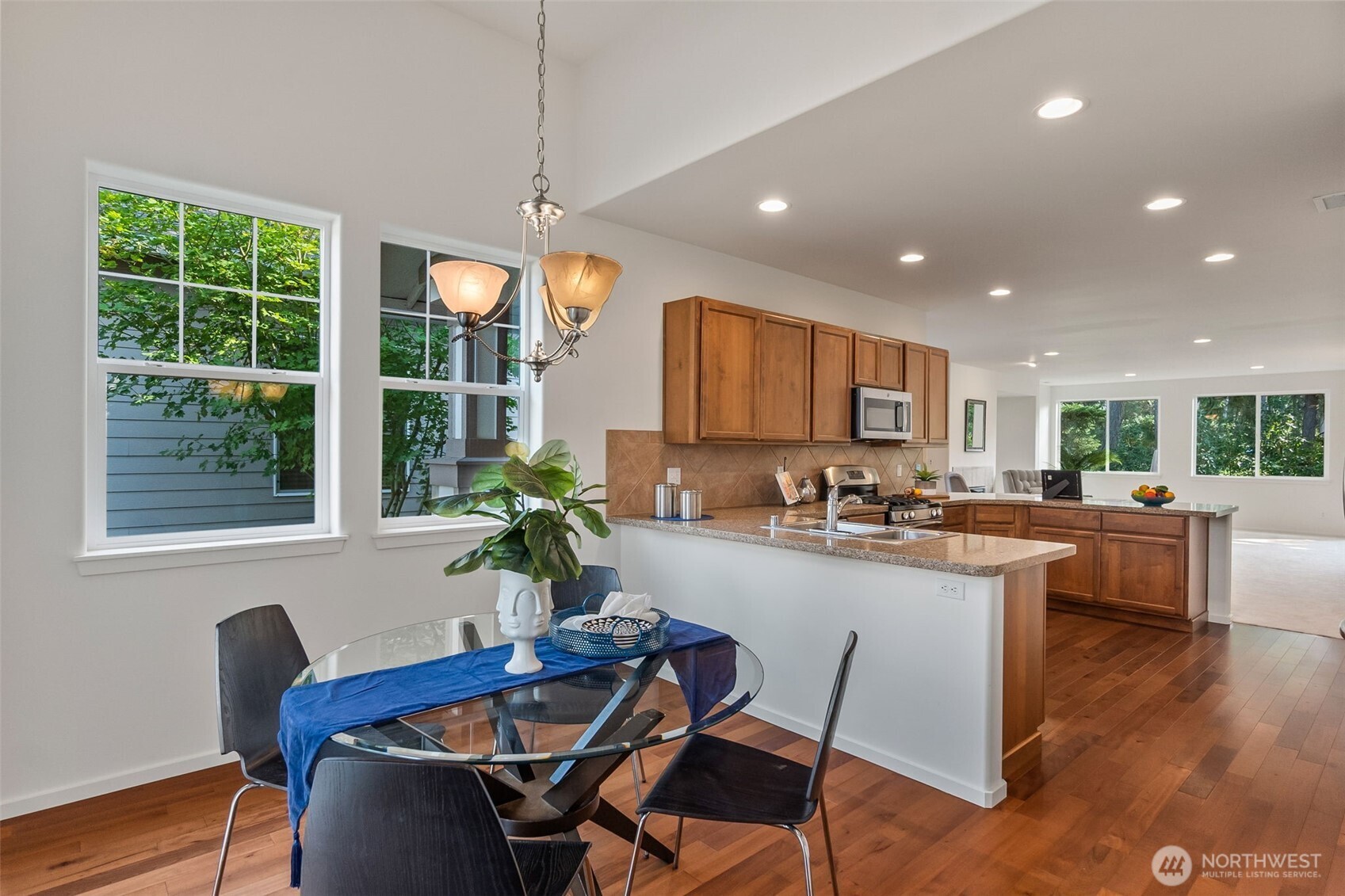 8231 Orcas Loop Northeast Lacey, WA 98516 - Photo 8 of 23 a kitchen with a table and chairs in it