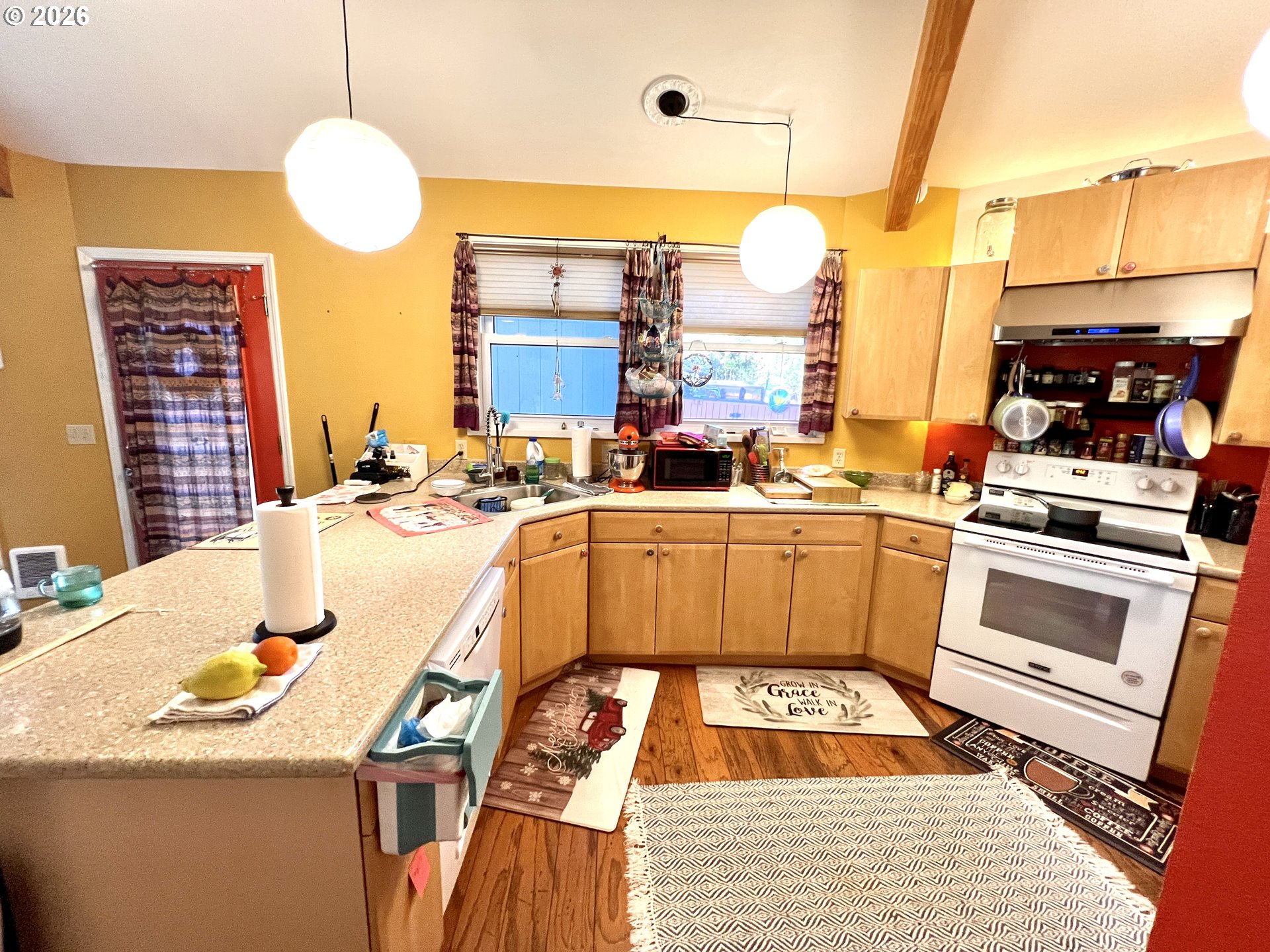 1625 Kristi Loop Lakeside, OR 97449 - Photo 12 of 41 a kitchen with a sink and a stove