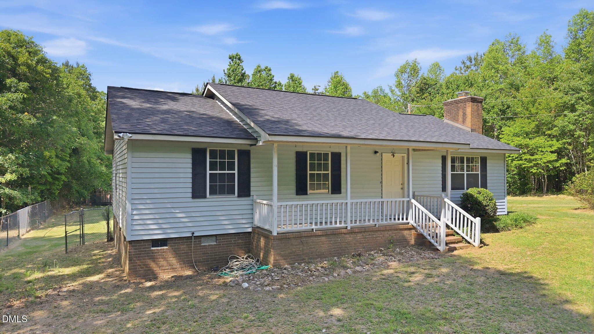 3602 Harrison Road Castalia, NC 27816 - Photo 2 of 48 a front view of a house with a yard and outdoor seating