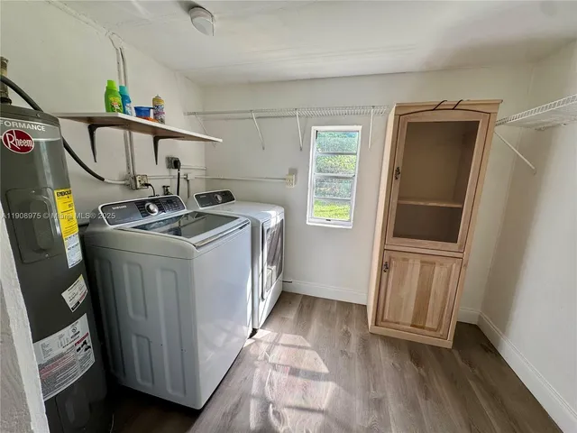 a utility room with dryer and washer