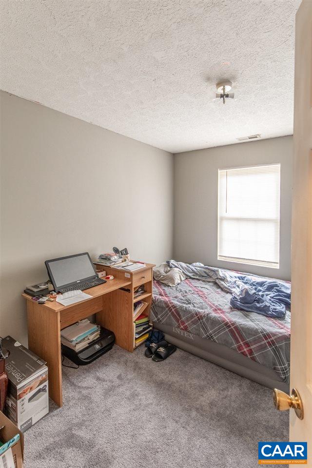 1504 Adial Road Faber, VA 22938 - Photo 21 of 22 a bedroom with a bed and a window