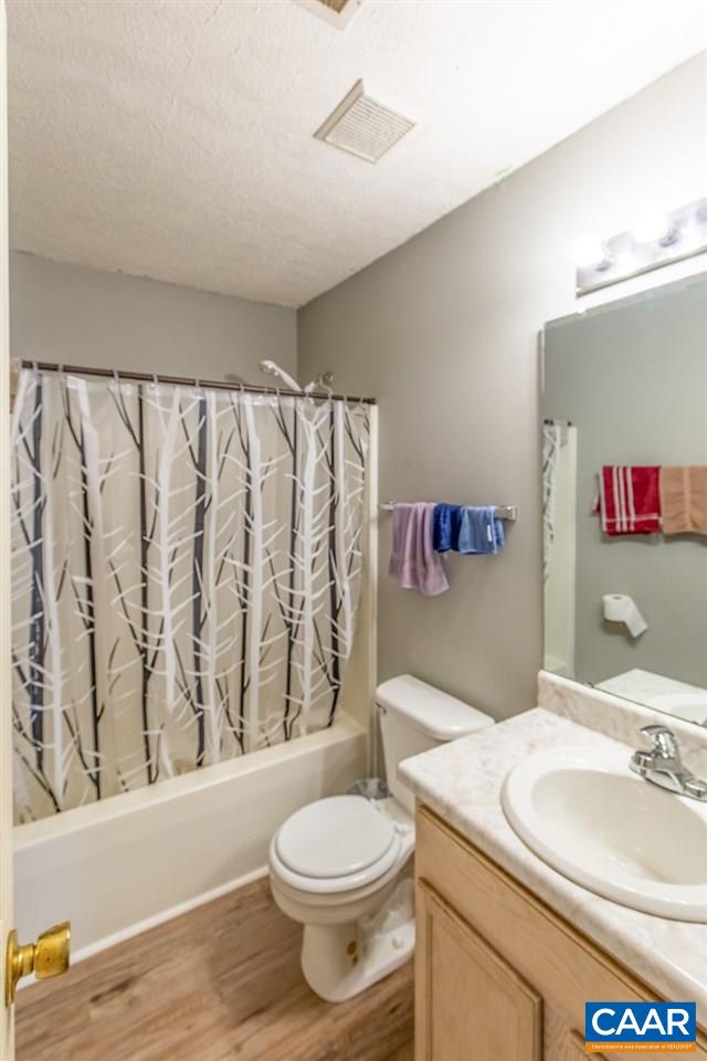 1504 Adial Road Faber, VA 22938 - Photo 22 of 22 a bathroom with a granite countertop sink mirror vanity and toilet