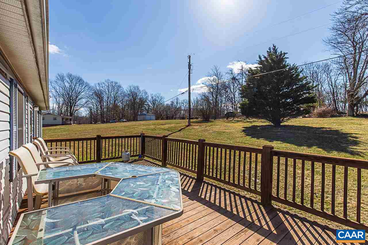 1504 Adial Road Faber, VA 22938 - Photo 6 of 22 a view of a wooden deck with a yard