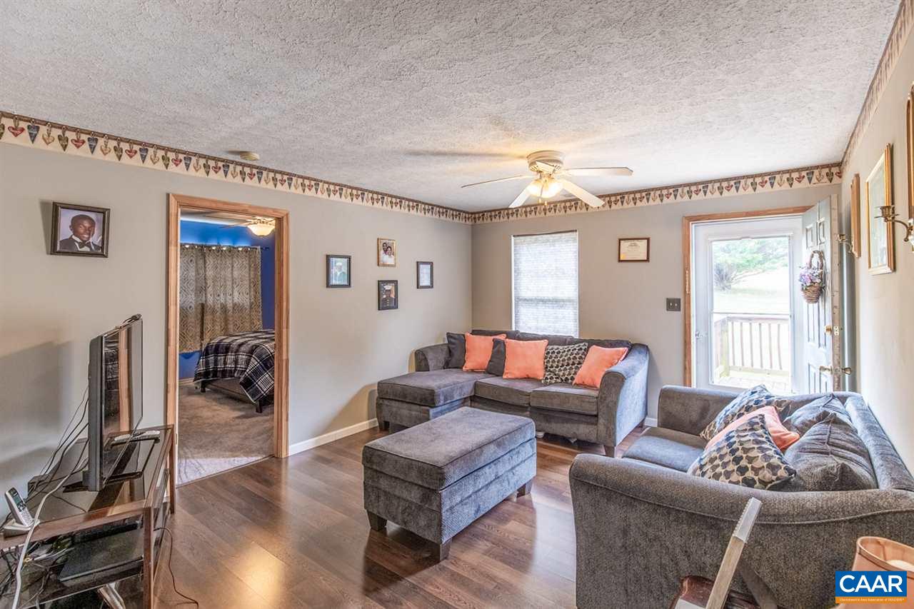 1504 Adial Road Faber, VA 22938 - Photo 10 of 22 a living room with furniture a window and a flat screen tv