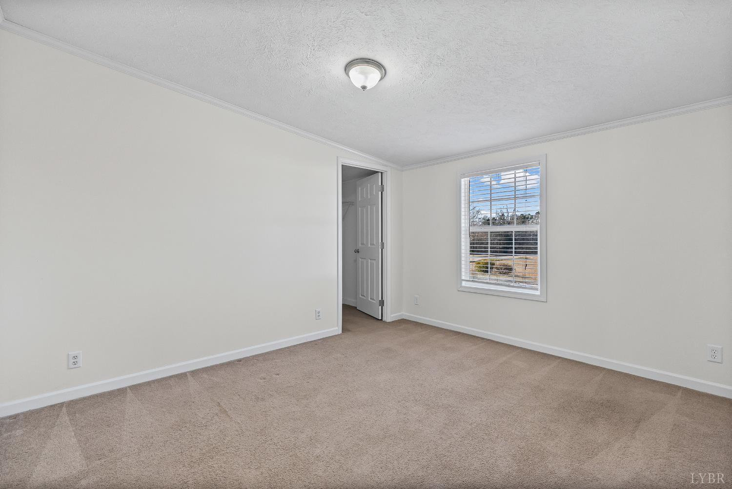 13116 Brookneal Highway Gladys, VA 24554 - Photo 18 of 34 an empty room with windows