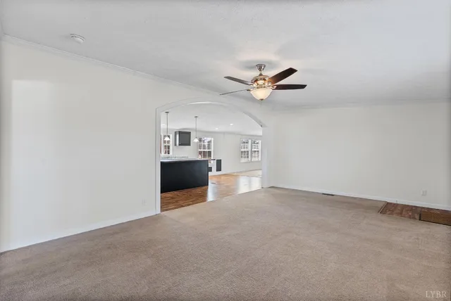 an empty room with a kitchen