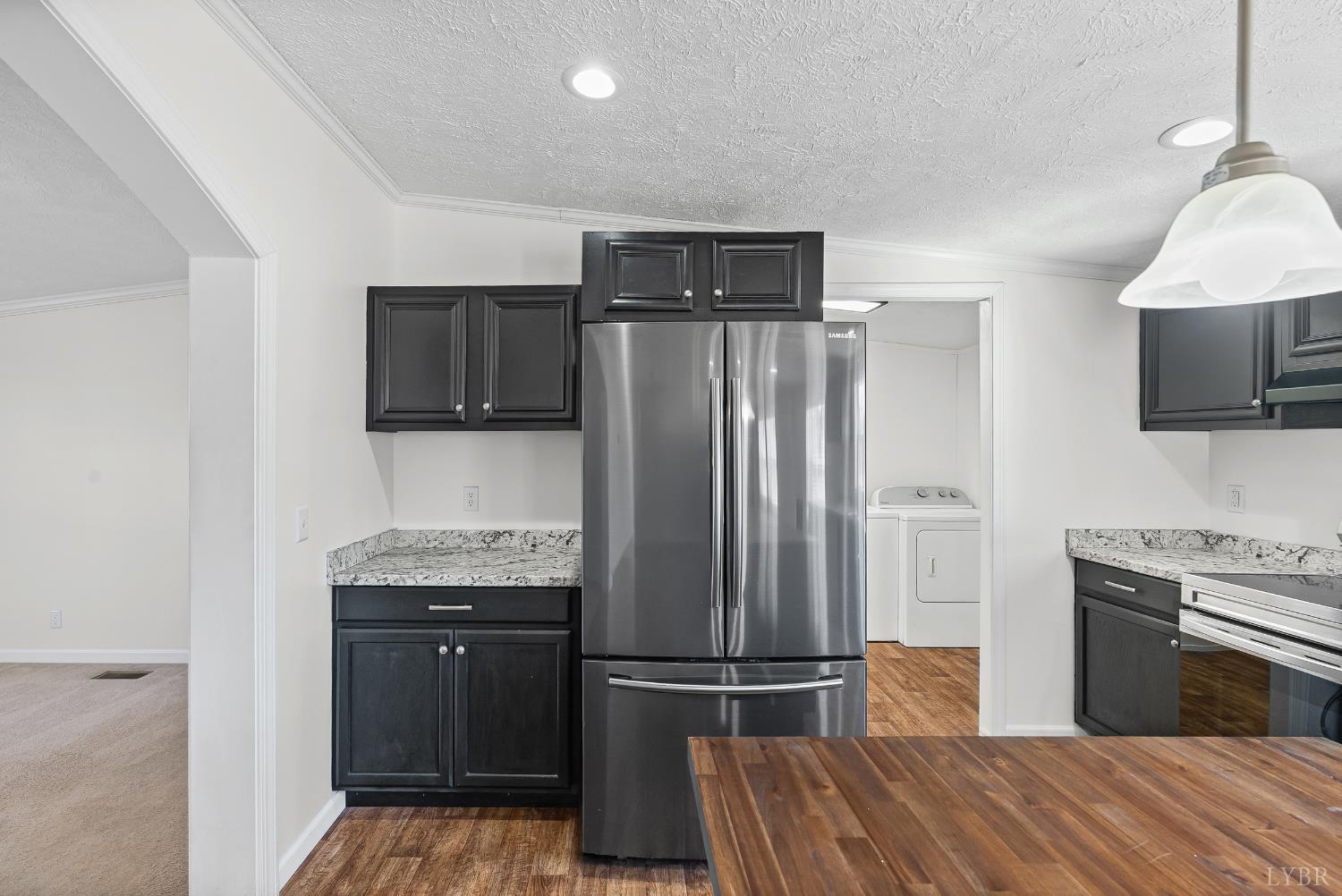 13116 Brookneal Highway Gladys, VA 24554 - Photo 9 of 34 a kitchen with granite countertop a refrigerator stove and microwave