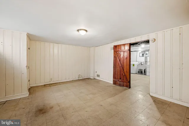 a view of an empty room with closet area