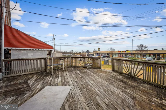 a view of a balcony with wooden floor