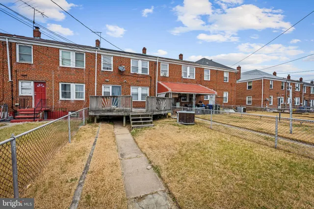 a view of a large building with a swimming pool