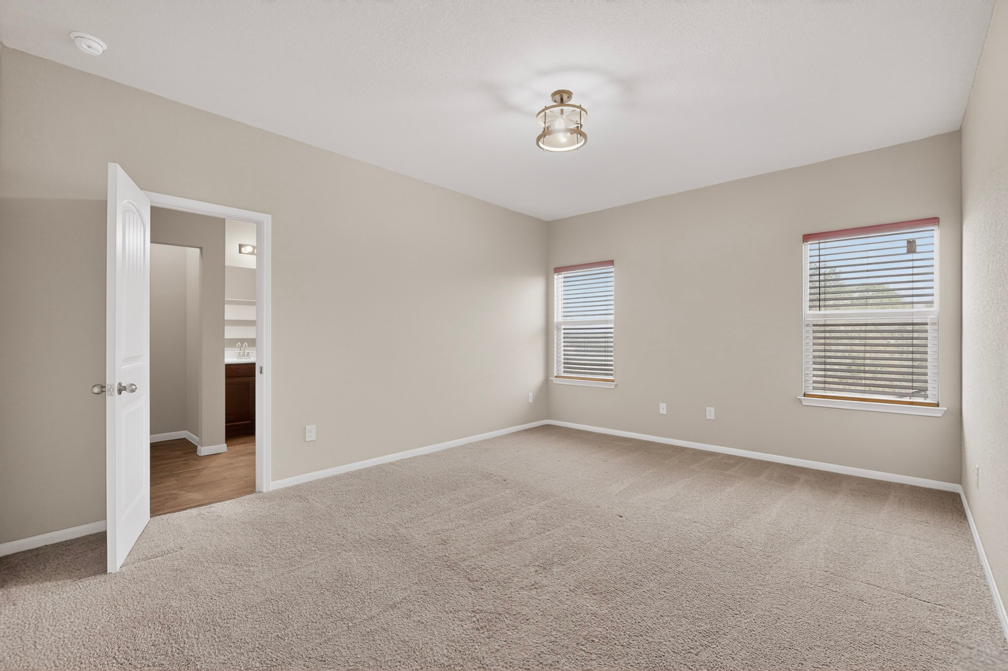 5905 Diamondleaf Bend Austin, TX 78724 - Photo 16 of 38 Spacious room featuring neutral carpeting, light-toned walls, and crown molding