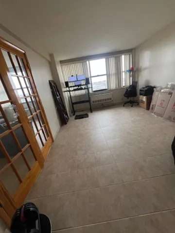 a view of a livingroom with furniture and windows