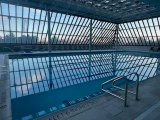 a view of a black white bench sitting in back of a balcony
