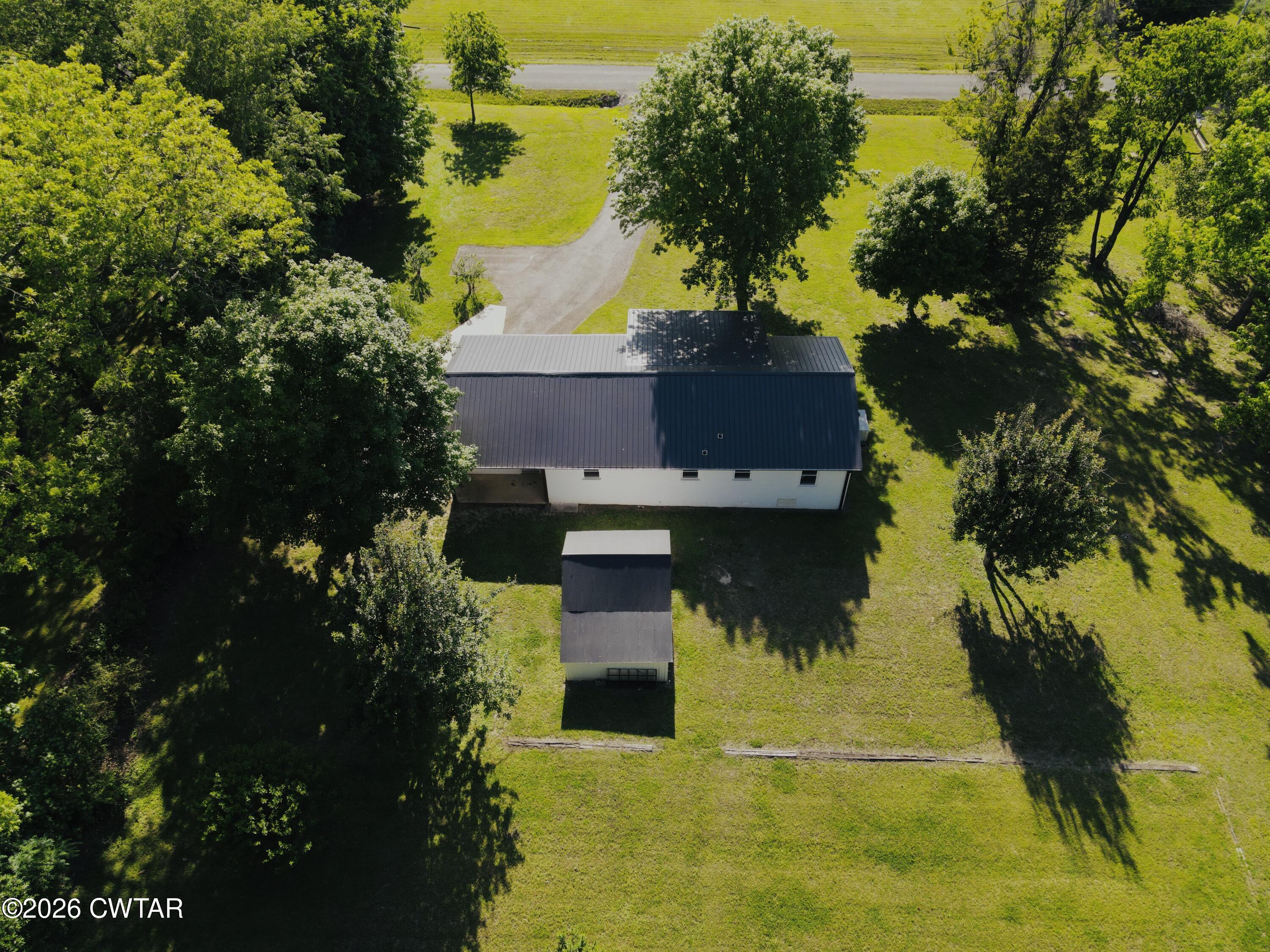 98 Reagan Road Dyersburg, TN 38024 - Photo 18 of 31 a view of a house with a yard