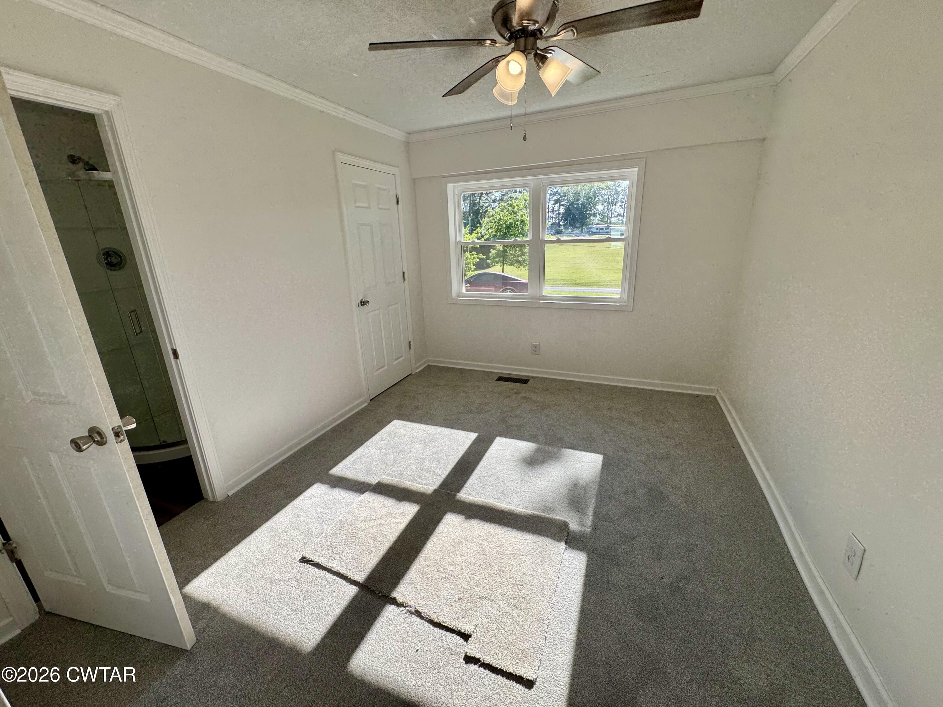 98 Reagan Road Dyersburg, TN 38024 - Photo 25 of 31 wooden floor with windows and entrance