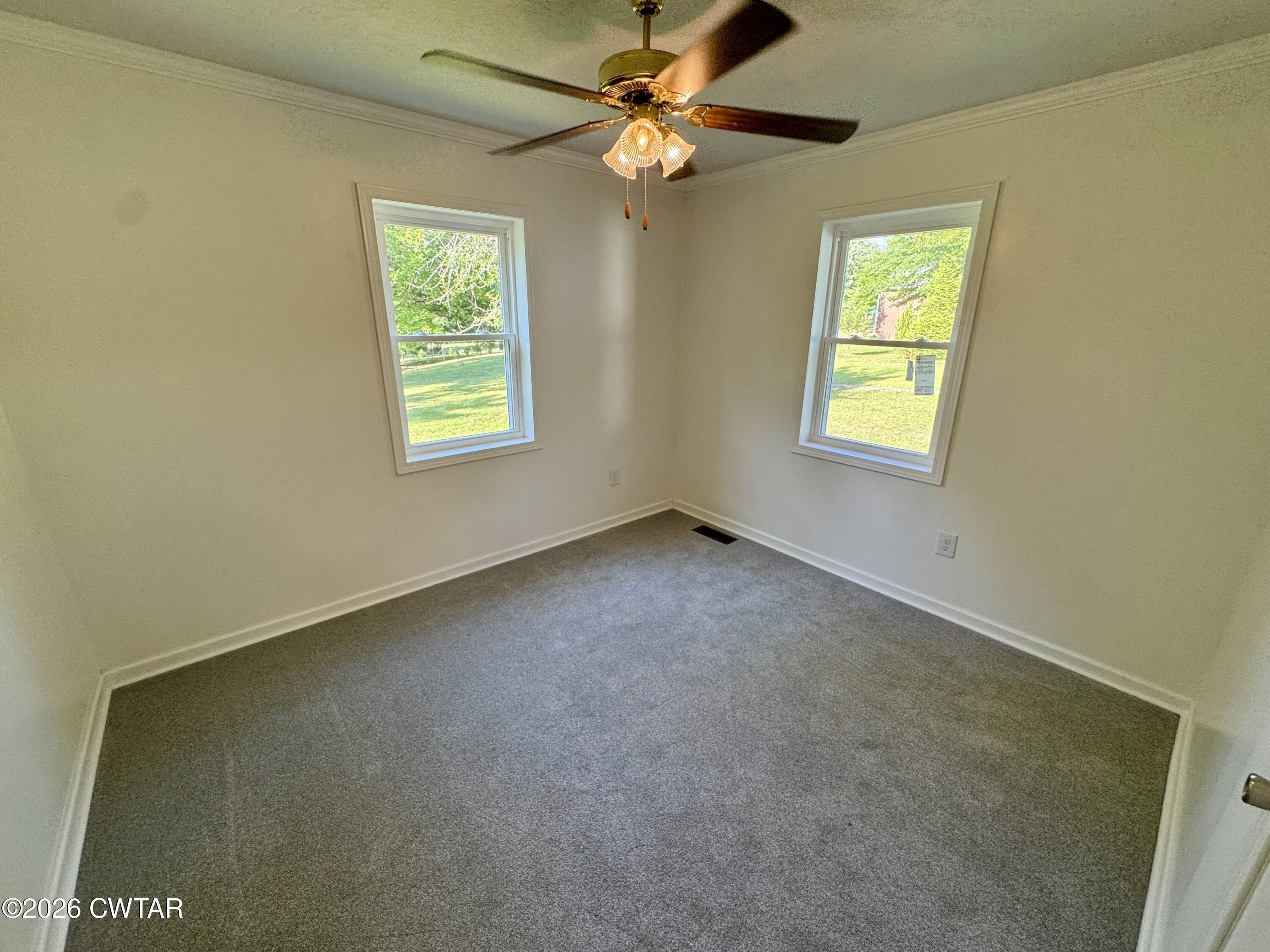 98 Reagan Road Dyersburg, TN 38024 - Photo 27 of 31 a view of an empty room with a window