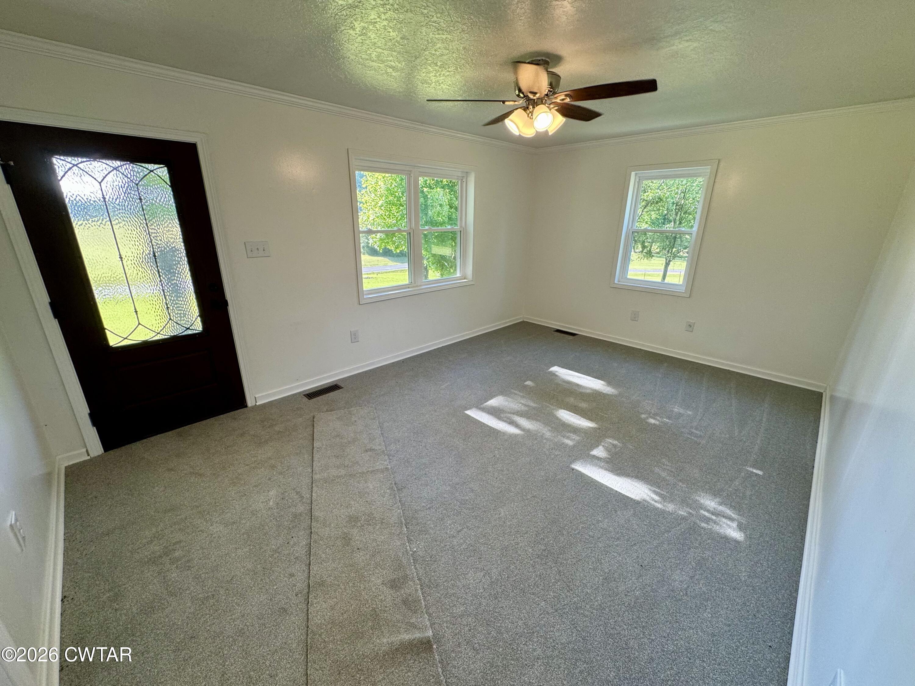 98 Reagan Road Dyersburg, TN 38024 - Photo 29 of 31 a view of an empty room with a window