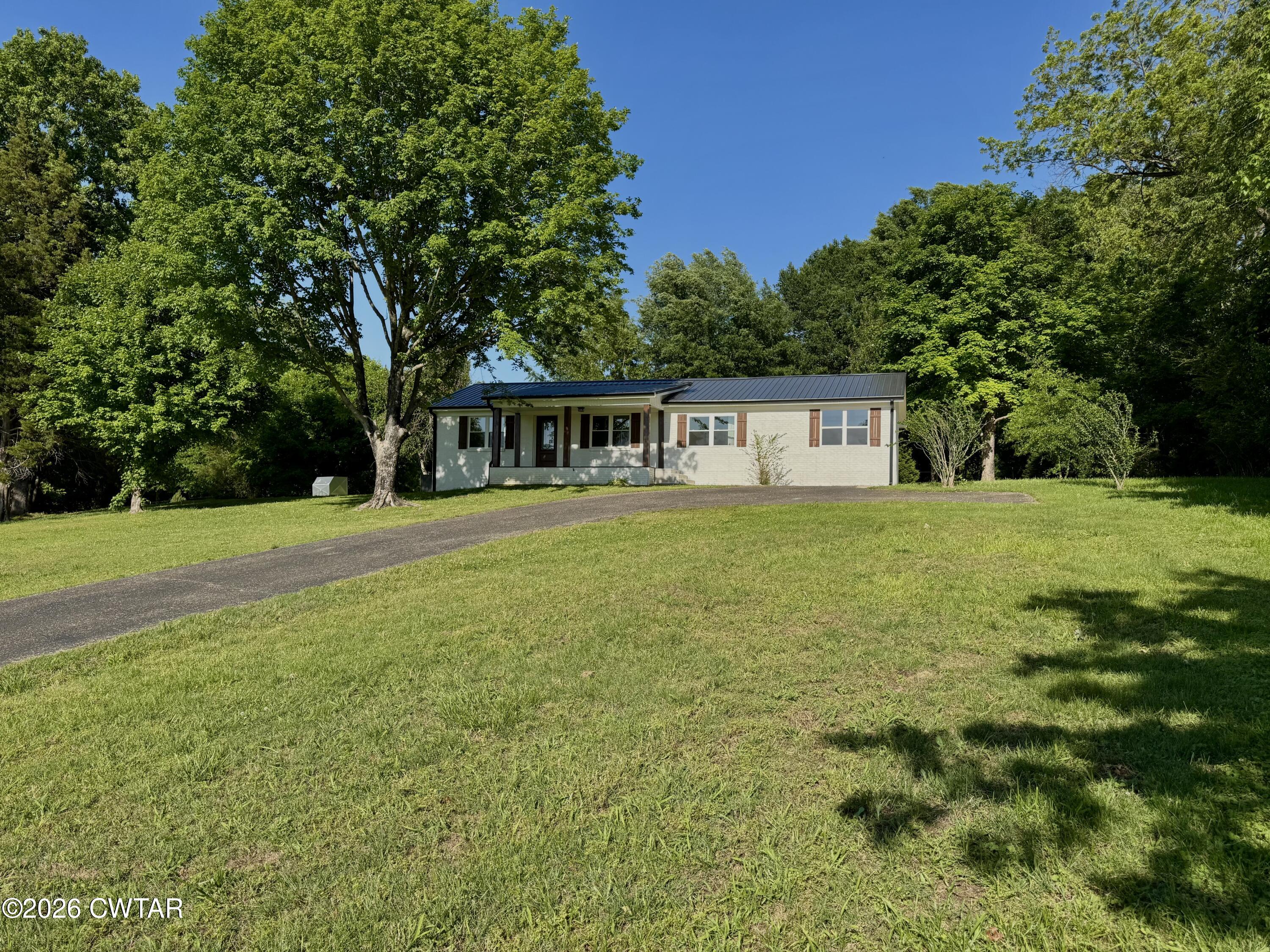 98 Reagan Road Dyersburg, TN 38024 - Photo 3 of 31 a view of a house with yard and sitting area