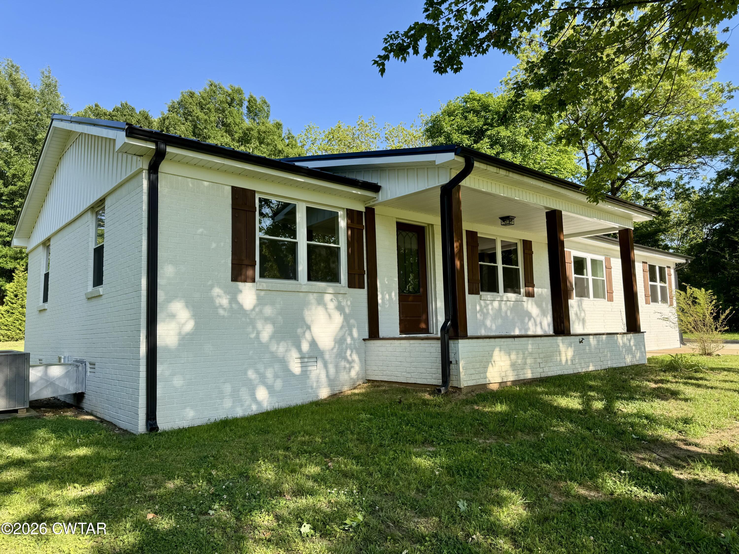 98 Reagan Road Dyersburg, TN 38024 - Photo 6 of 31 a view of a house with backyard
