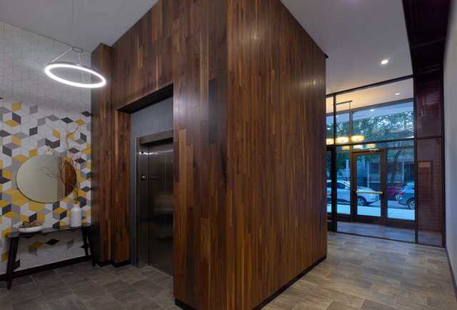 Undisclosed Address Chicago, IL 60657 - Photo 3 of 17 a view of a entryway door of the house and living room