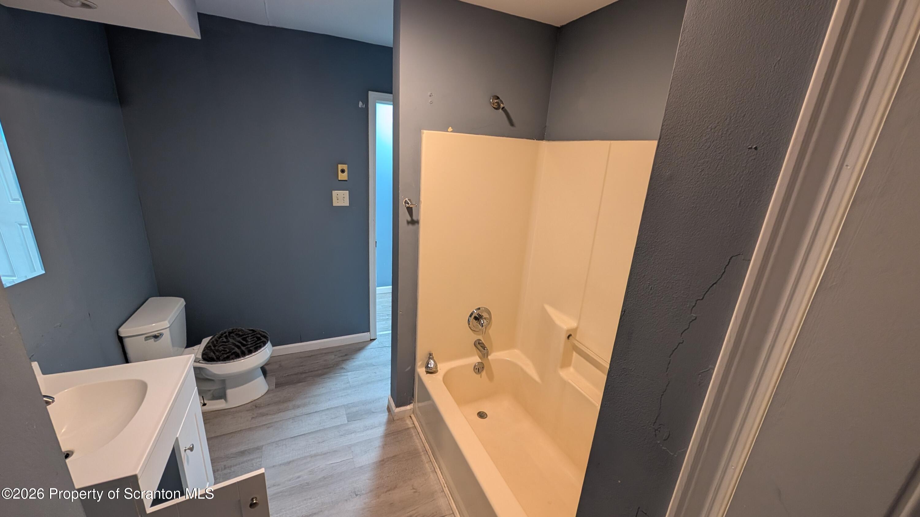 114 Prospect Avenue, Unit 4 Scranton, PA 18505 - Photo 11 of 16 a bathroom with a bathtub and toilet