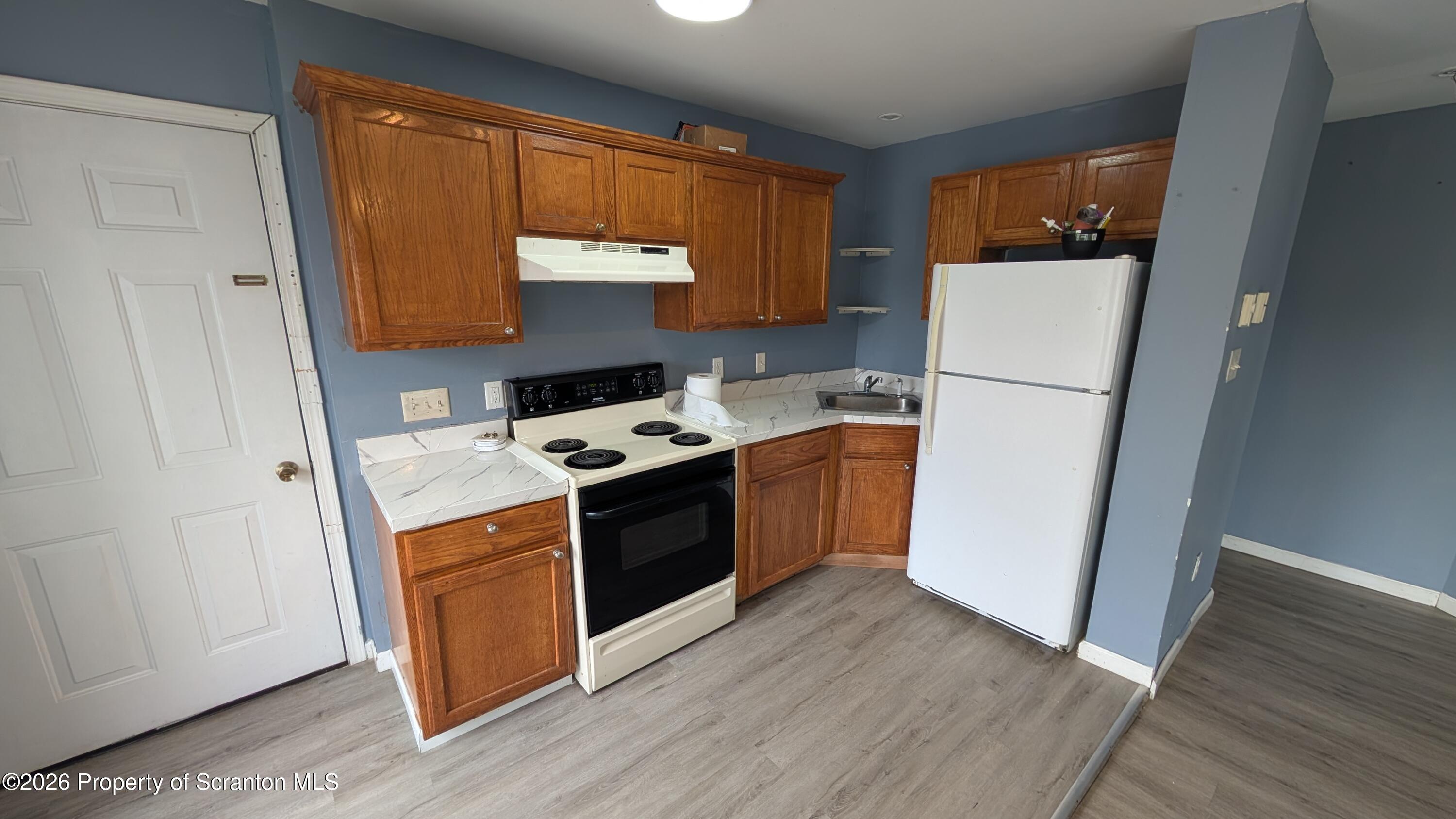 114 Prospect Avenue, Unit 4 Scranton, PA 18505 - Photo 3 of 16 a utility room with wooden floor washer and dryer