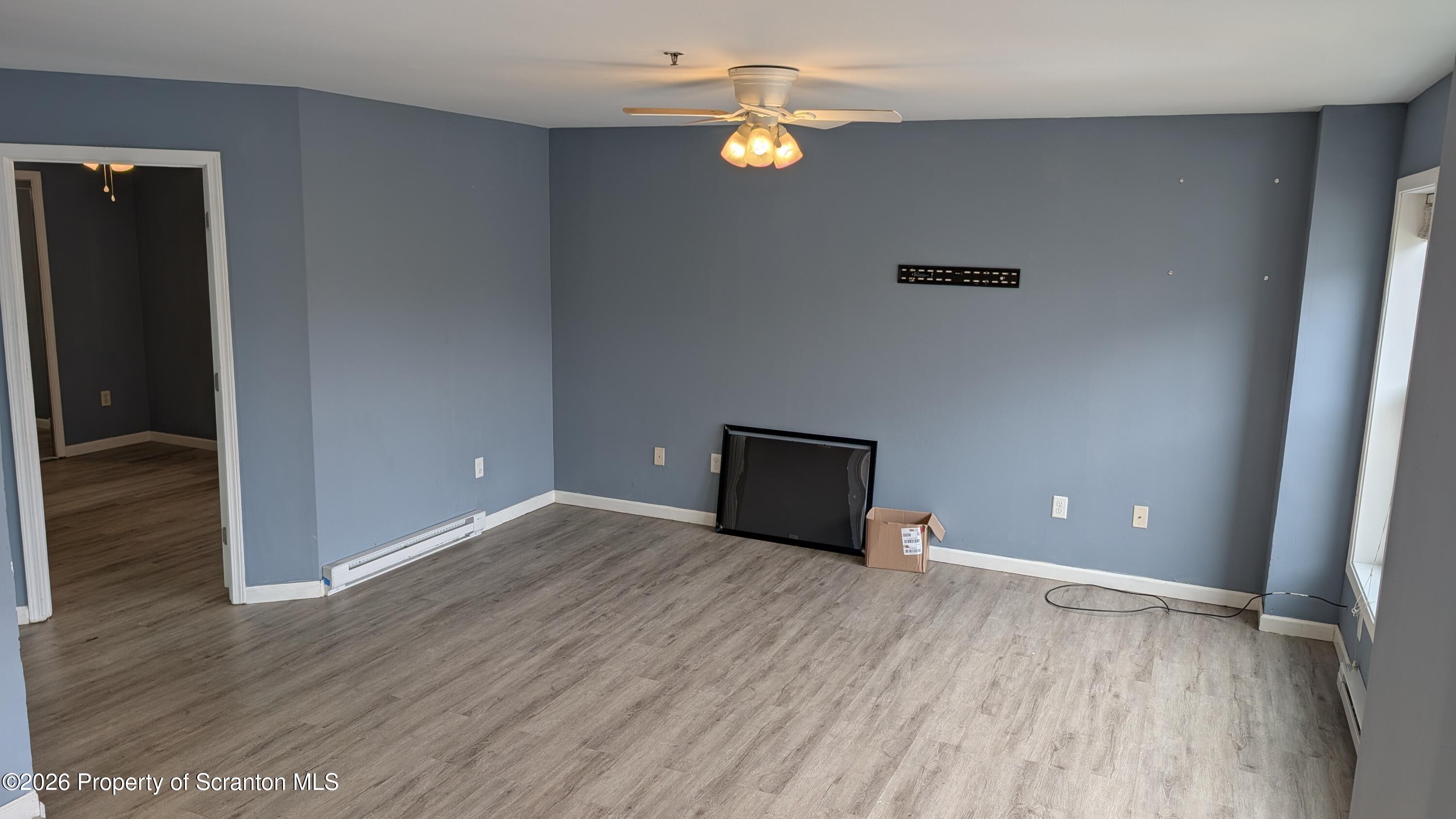114 Prospect Avenue, Unit 4 Scranton, PA 18505 - Photo 4 of 16 wooden floor in an empty room with a window
