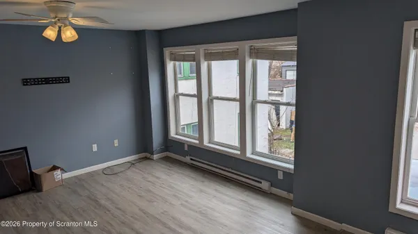 a view of an empty room with a window