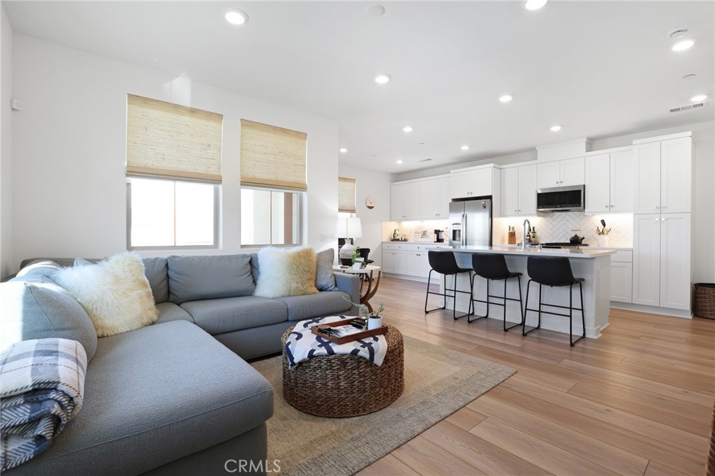 1300 Lasso Way, Unit 301 Rancho Mission Viejo, CA 92694 - Photo 17 of 17 a living room with furniture and a large window