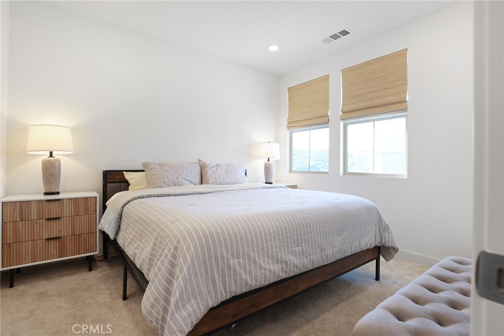 1300 Lasso Way, Unit 301 Rancho Mission Viejo, CA 92694 - Photo 10 of 17 a bedroom with a bed and window