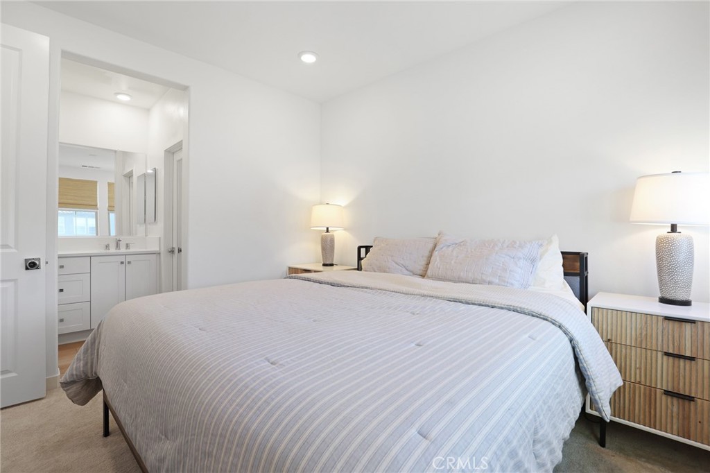 1300 Lasso Way, Unit 301 Rancho Mission Viejo, CA 92694 - Photo 11 of 17 a bedroom with a bed and a lamp