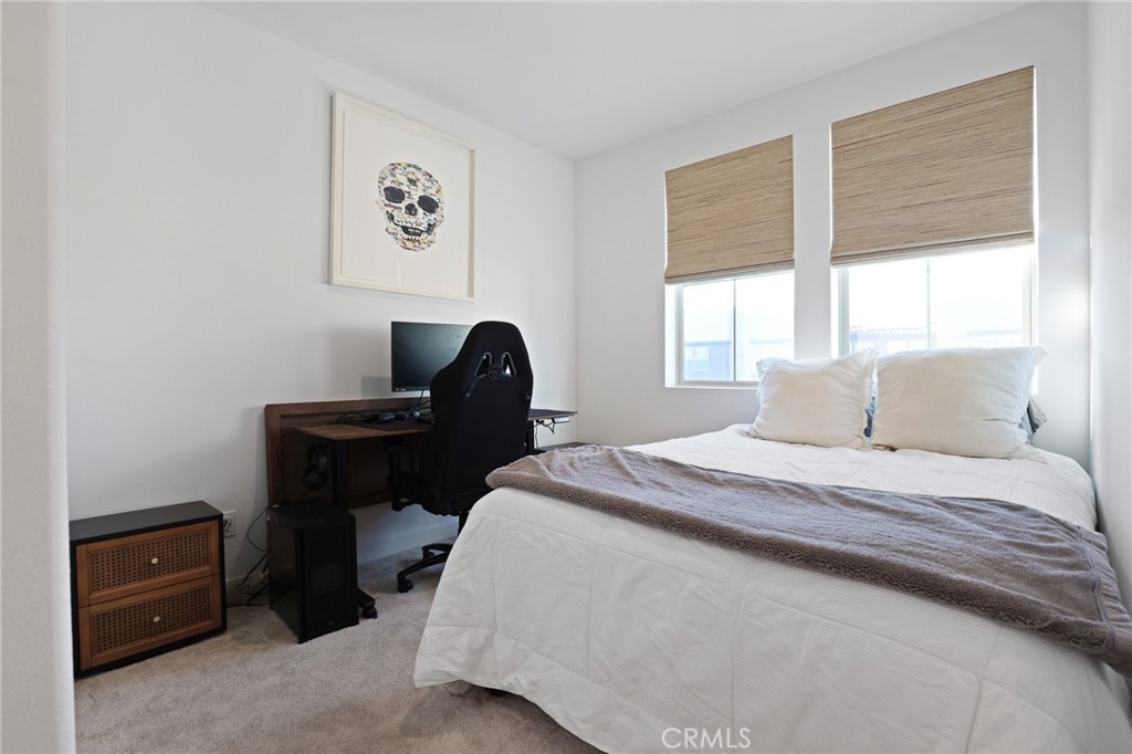 1300 Lasso Way, Unit 301 Rancho Mission Viejo, CA 92694 - Photo 13 of 17 a bedroom with a bed and a window
