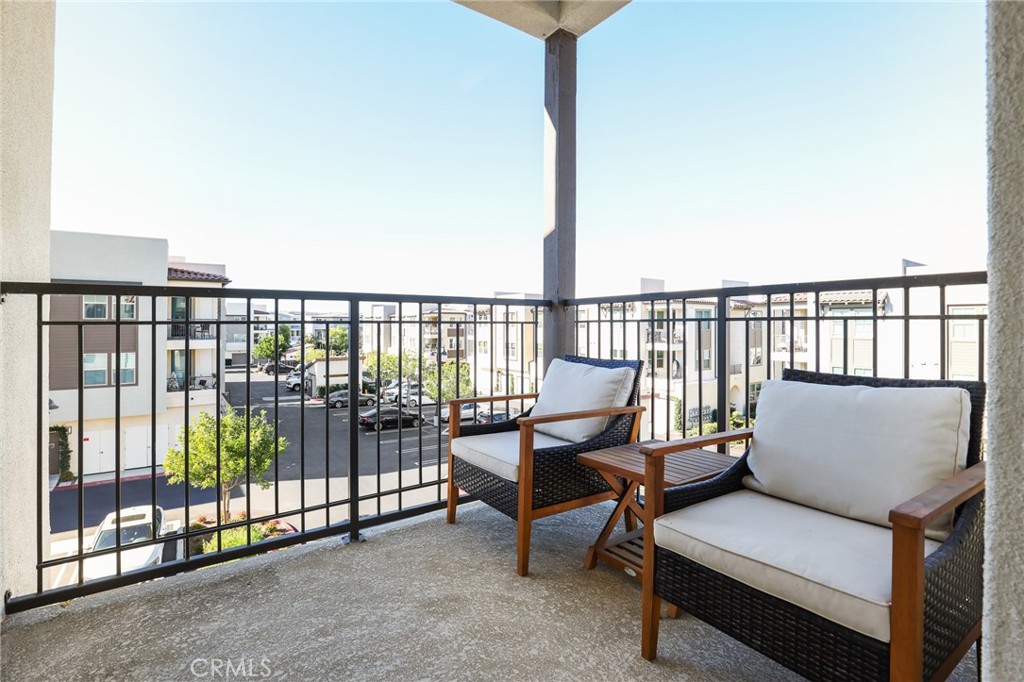 1300 Lasso Way, Unit 301 Rancho Mission Viejo, CA 92694 - Photo 15 of 17 a balcony with a couch
