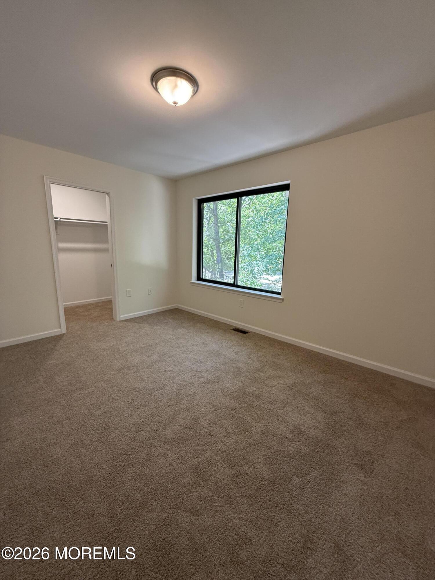 5 Canary Circle Howell, NJ 07731 - Photo 28 of 32 an empty room with windows and closet