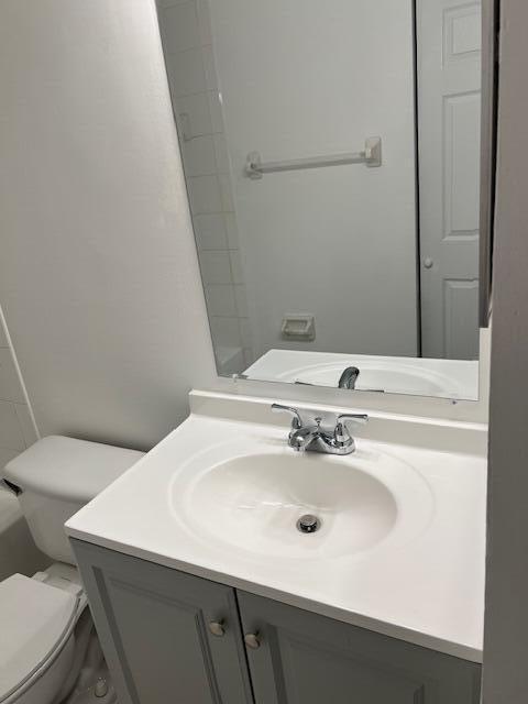 140 Baldwin Boulevard Greenacres, FL 33463 - Photo 12 of 18 a bathroom with a sink toilet and mirror