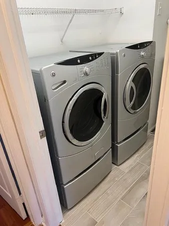 a utility room with dryer and washer
