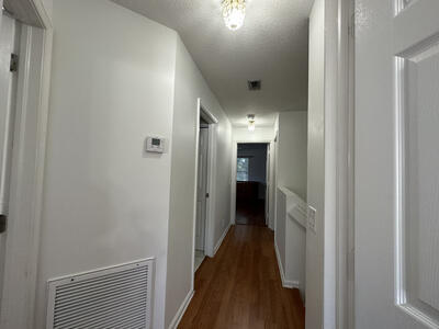140 Baldwin Boulevard Greenacres, FL 33463 - Photo 18 of 18 a view of a hallway with wooden floor