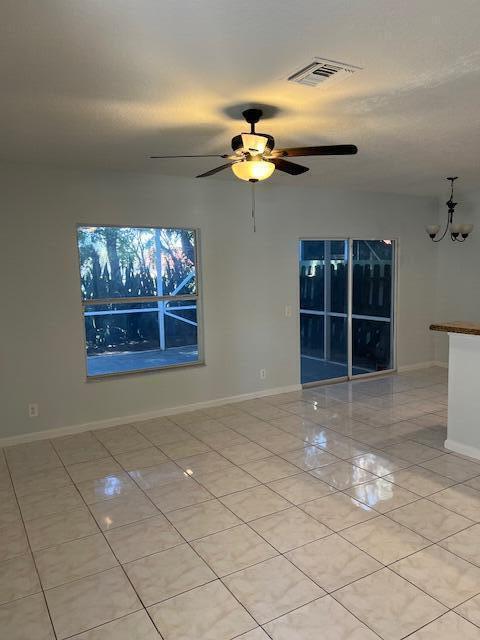 140 Baldwin Boulevard Greenacres, FL 33463 - Photo 3 of 18 a view of a livingroom with a chandelier fan and window