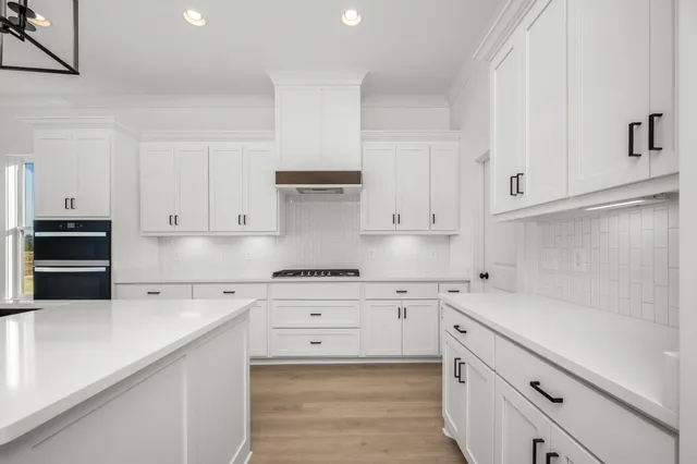 a bathroom with a sink and a window