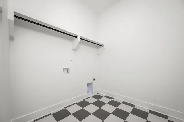 a view of a storage & utility room with a sink