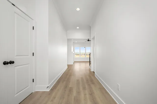 a view of a kitchen with a sink stainless steel appliances and cabinets