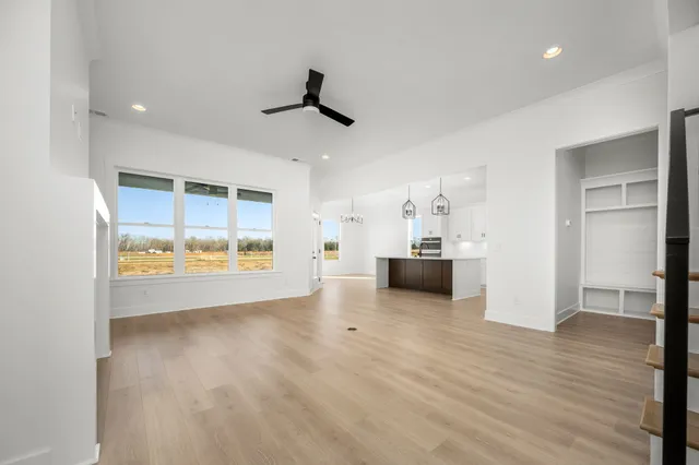 a kitchen with stainless steel appliances granite countertop a sink and cabinets