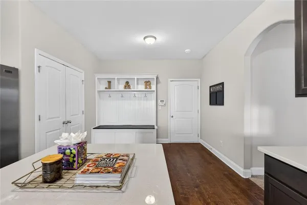 a kitchen with stainless steel appliances a refrigerator and a stove
