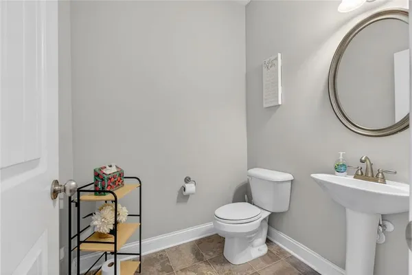 a bedroom with a bed couch and window