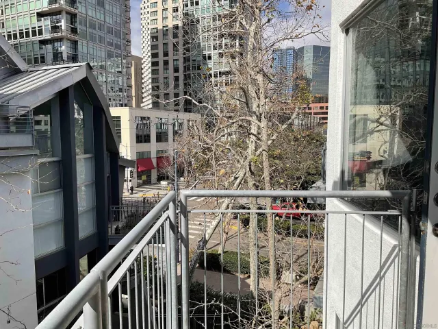 a view of balcony with wooden wall and outdoor seating
