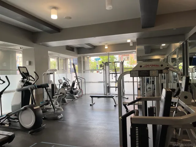 a gym room with lots of gym equipment