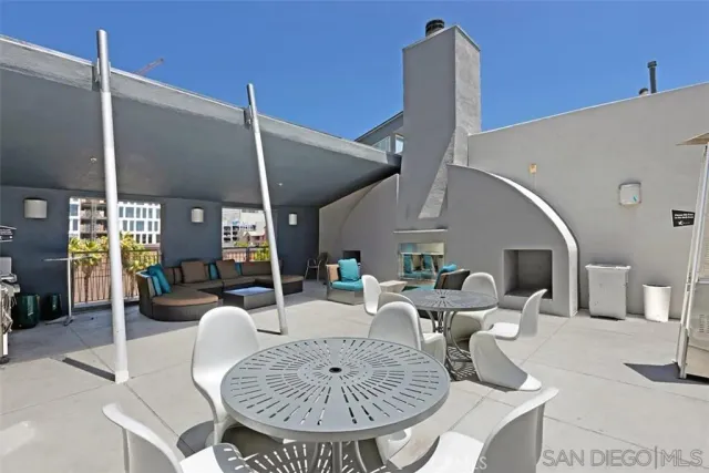 a living room with furniture a fireplace and a table