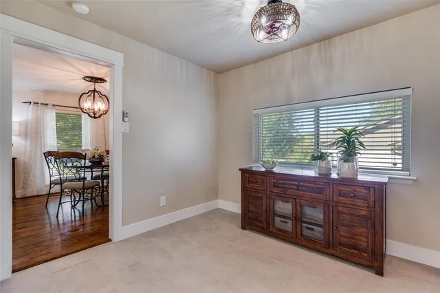 a large room with wooden floor and furniture