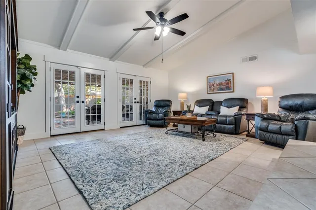 a living room with furniture and view of living room
